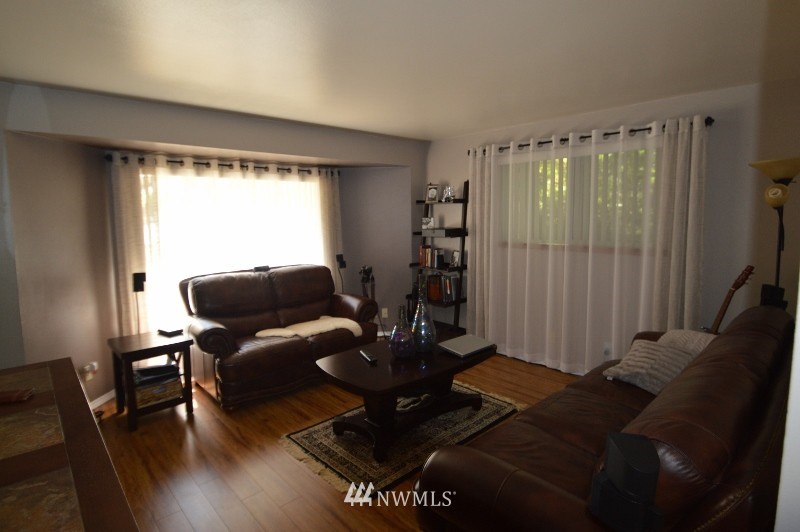 20607 West Richmond Road Bothell, WA 98021 - Photo 5 of 16 a living room with furniture and a large window
