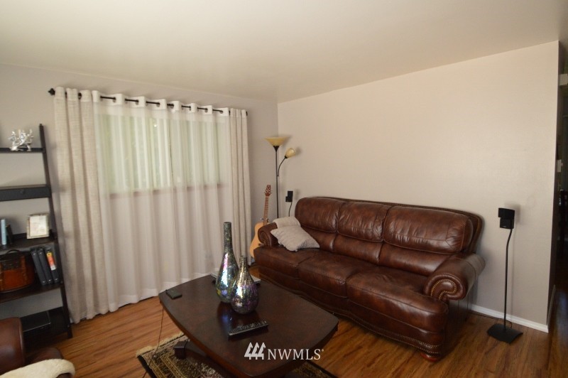 20607 West Richmond Road Bothell, WA 98021 - Photo 6 of 16 a living room with furniture and a wooden floor