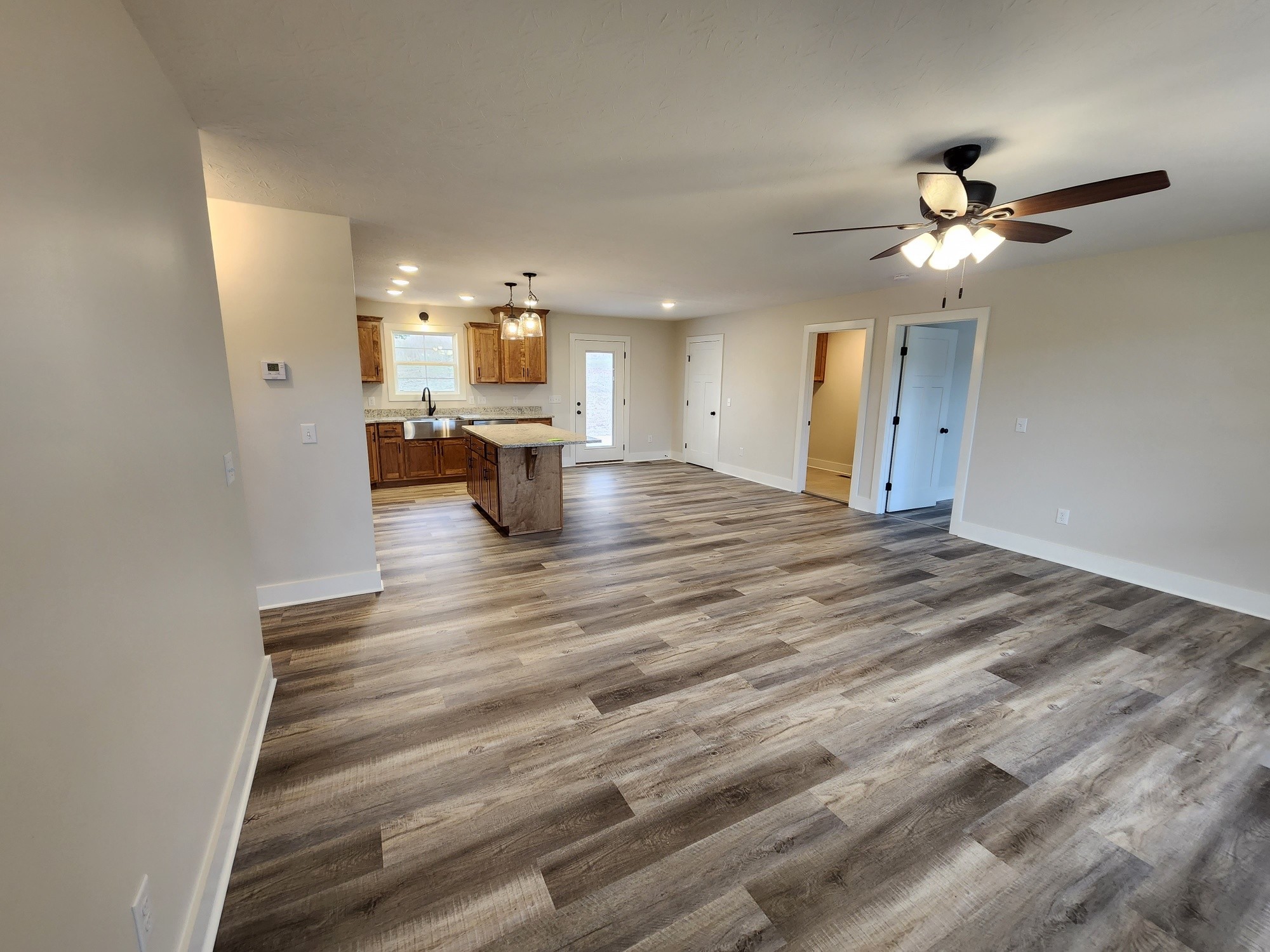 1672 Rock Bridge Road Bethpage, TN 37022 - Photo 11 of 26 a view of kitchen and dining room with wooden floor
