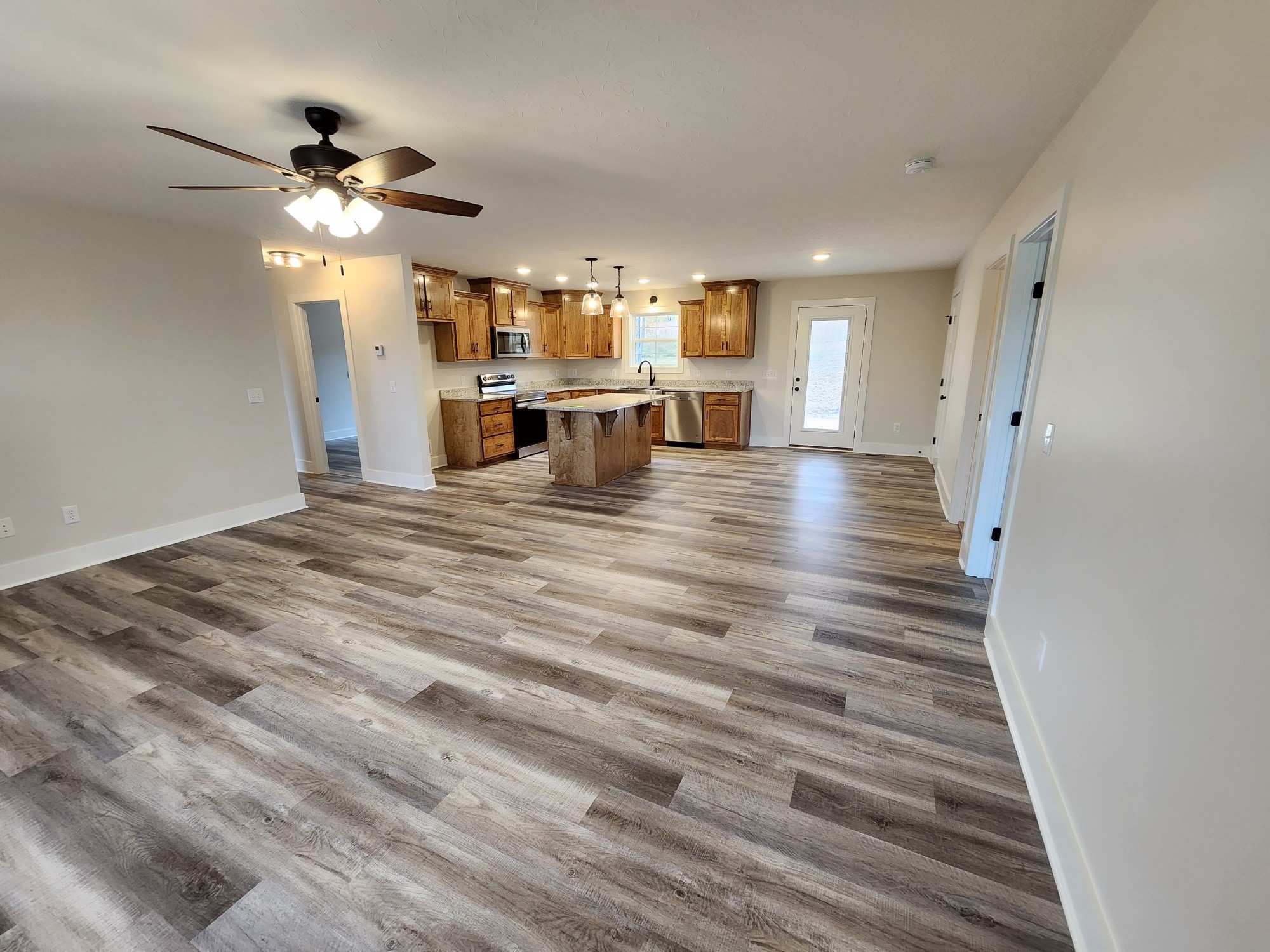 1672 Rock Bridge Road Bethpage, TN 37022 - Photo 12 of 26 a view of kitchen and dining room with wooden floor