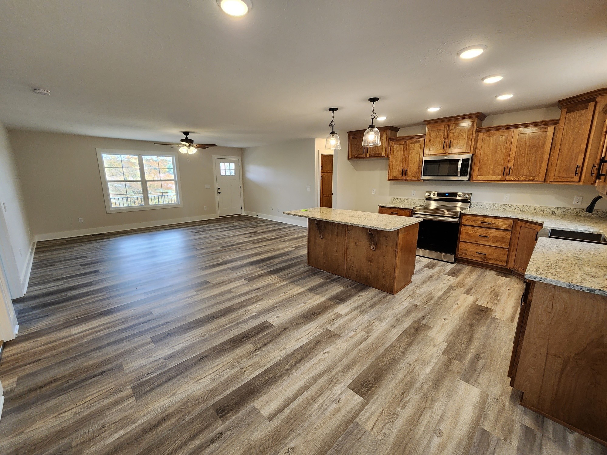 1672 Rock Bridge Road Bethpage, TN 37022 - Photo 14 of 26 a view of kitchen with cabinets microwave and stove