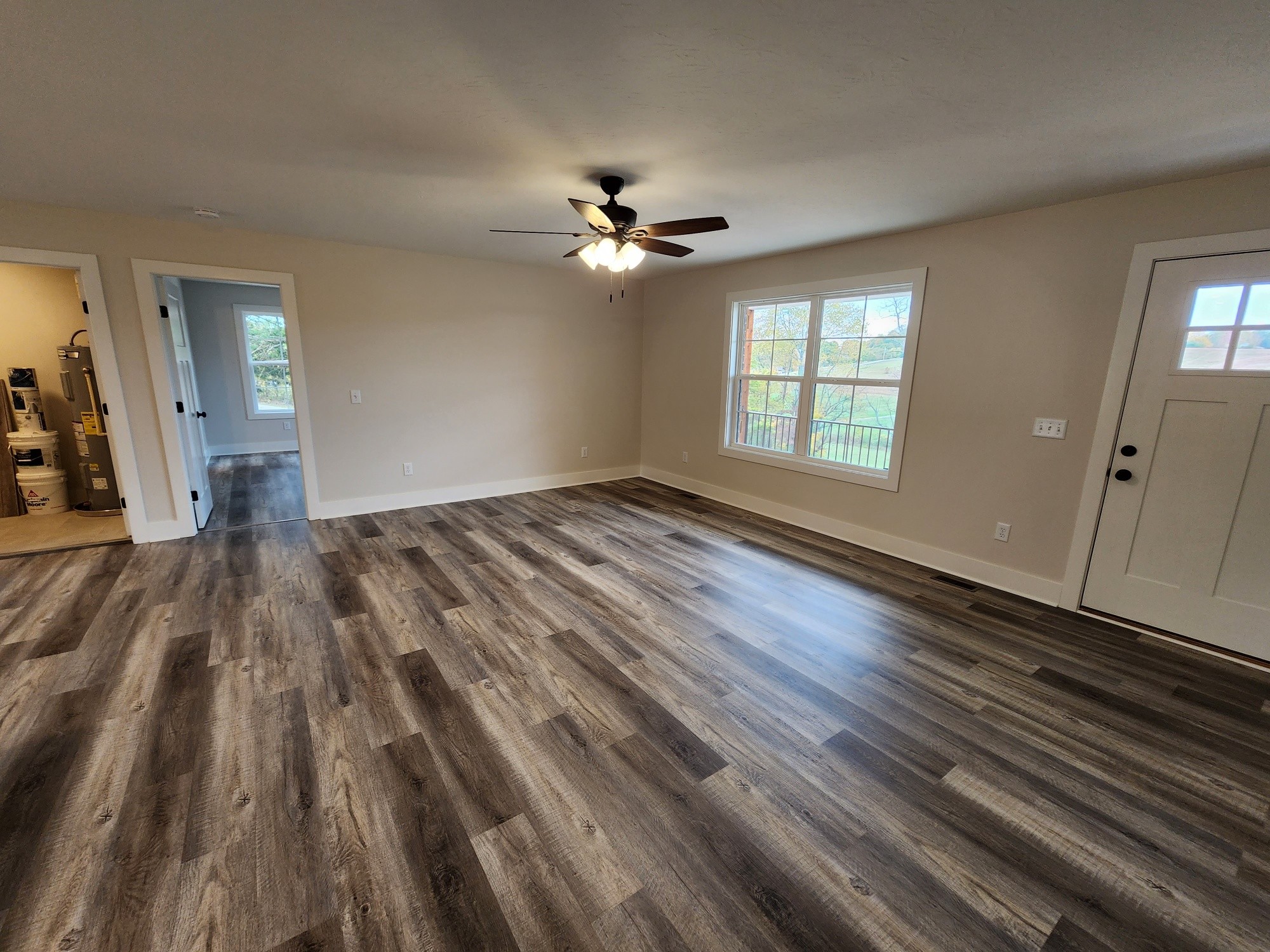 1672 Rock Bridge Road Bethpage, TN 37022 - Photo 17 of 26 wooden floor in an empty room with a window