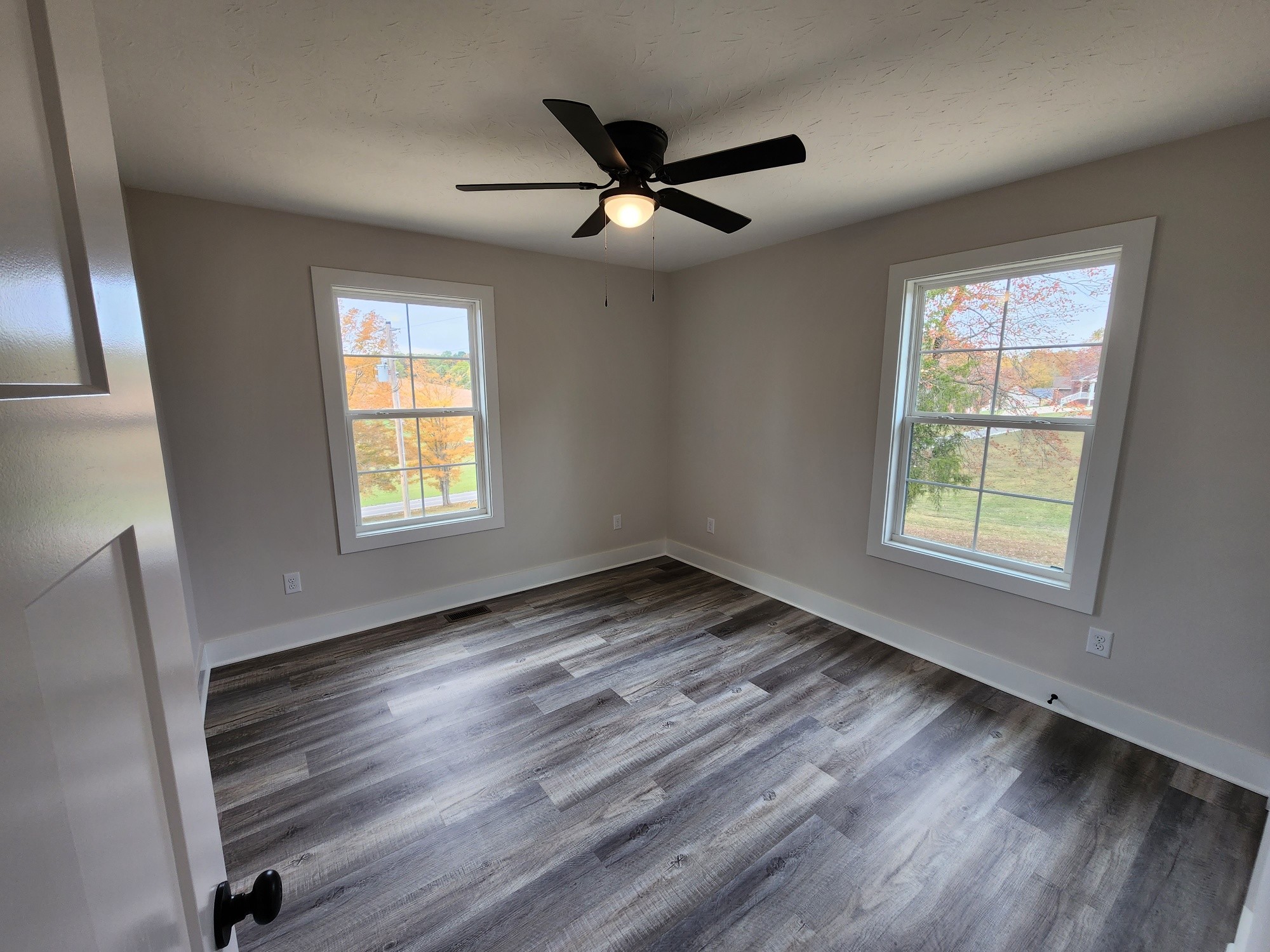 1672 Rock Bridge Road Bethpage, TN 37022 - Photo 23 of 26 a view of an empty room with wooden floor and a window