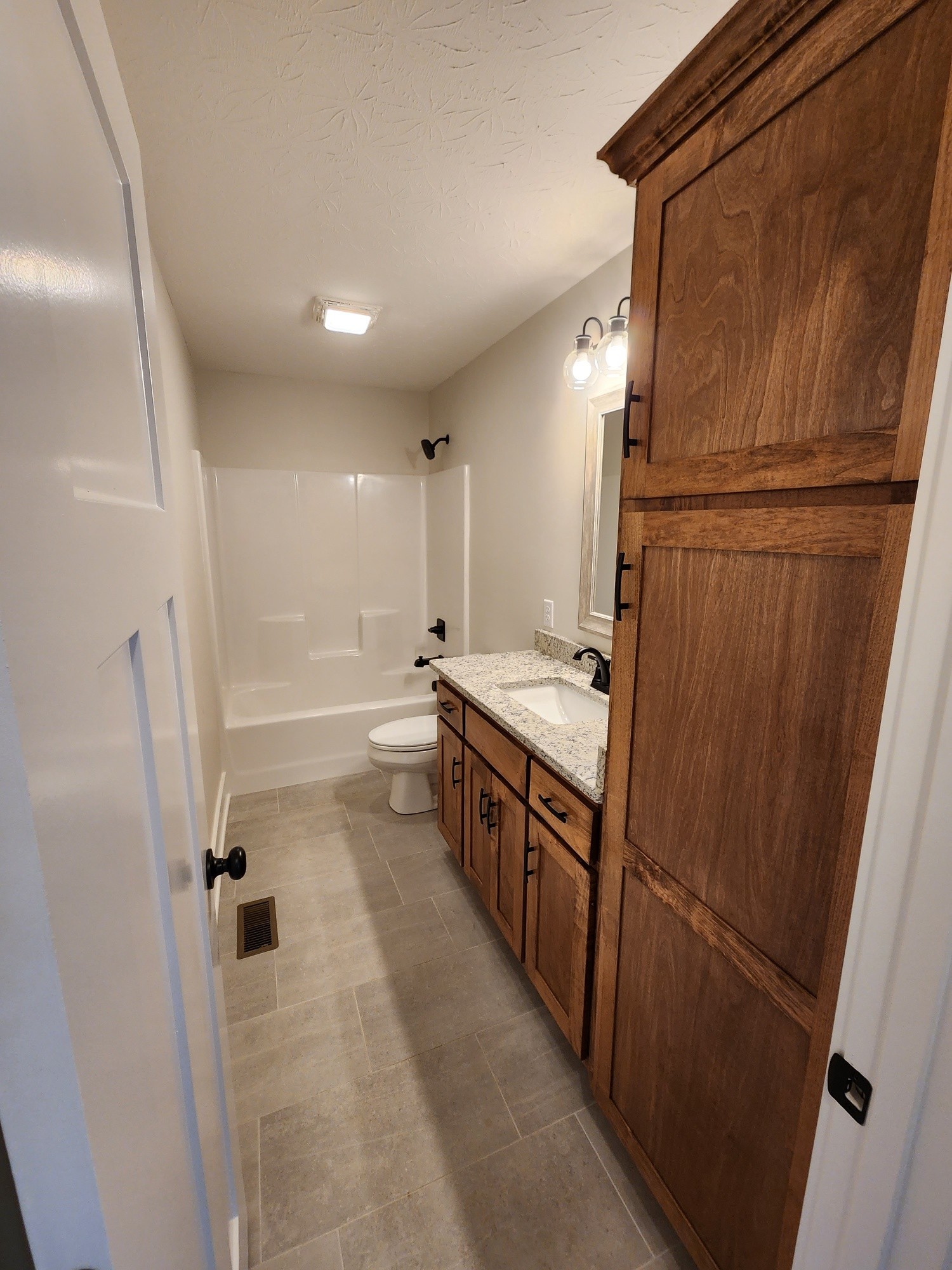 1672 Rock Bridge Road Bethpage, TN 37022 - Photo 24 of 26 a bathroom with double vanity and a tub