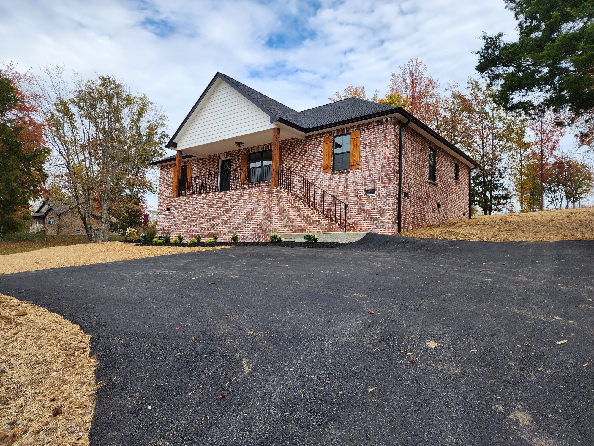 1672 Rock Bridge Road Bethpage, TN 37022 - Photo 3 of 26 a front view of a house with a yard and garage