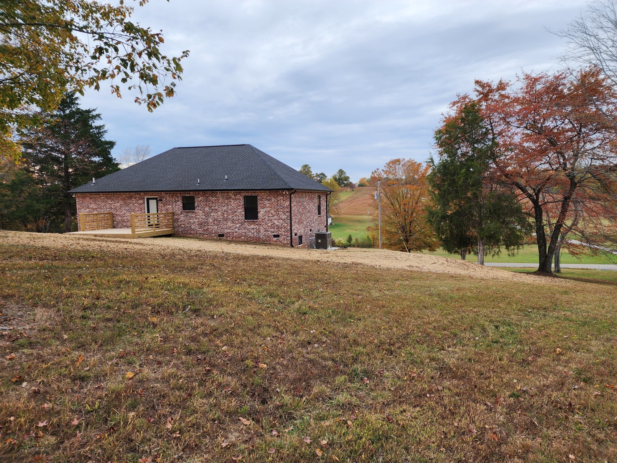 1672 Rock Bridge Road Bethpage, TN 37022 - Photo 4 of 26 a front view of a house with a yard