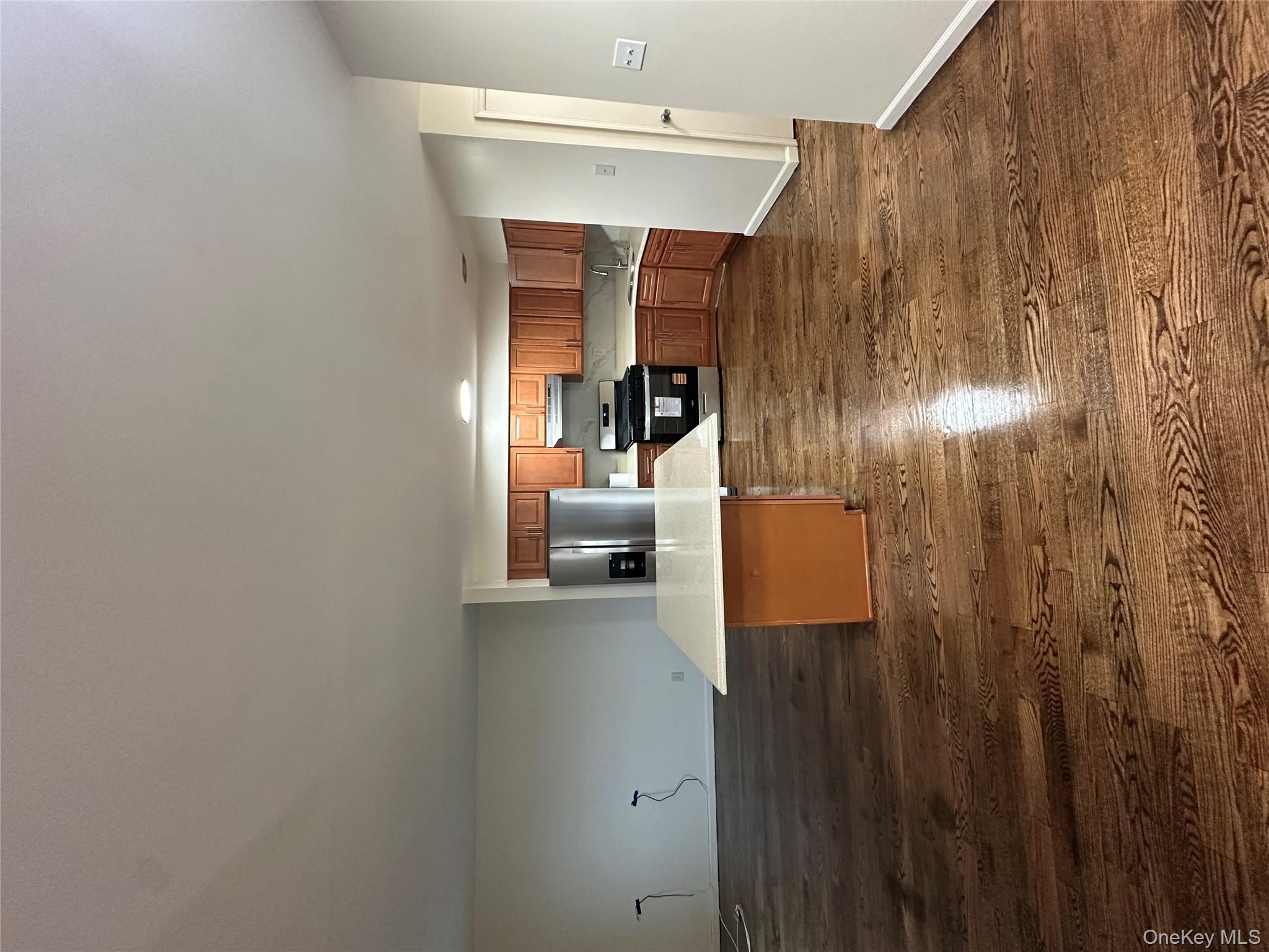 a view of kitchen and wooden floor