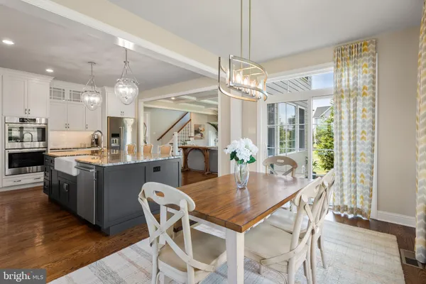 a kitchen with stainless steel appliances granite countertop a stove and cabinets