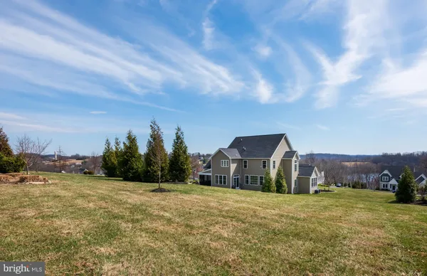 a view of a lake with a yard