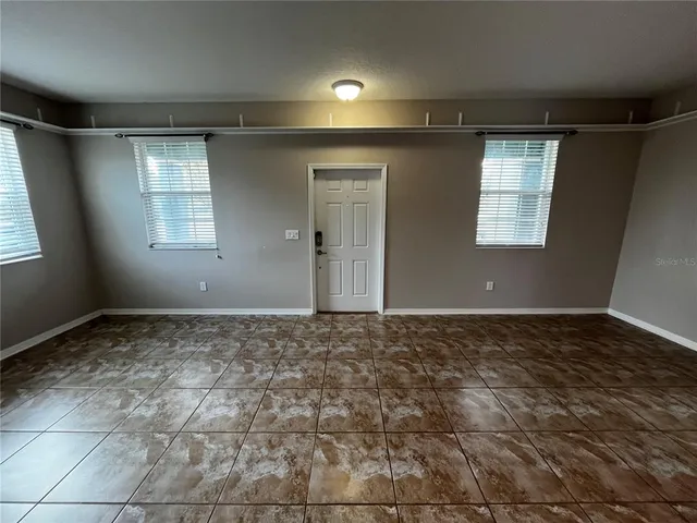 an empty room with windows