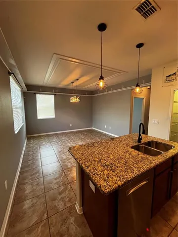 a room with a wooden floor and white walls