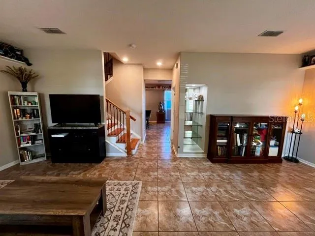 a view of a living room with a flat screen tv