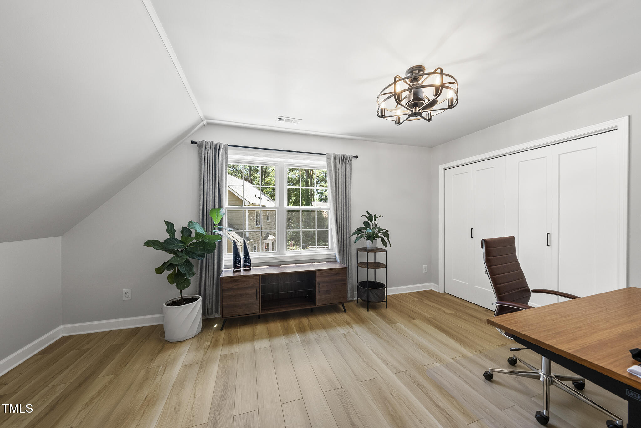 2704 Farnborough Road Raleigh, NC 27613 - Photo 29 of 39 a workspace with furniture window and wooden floor