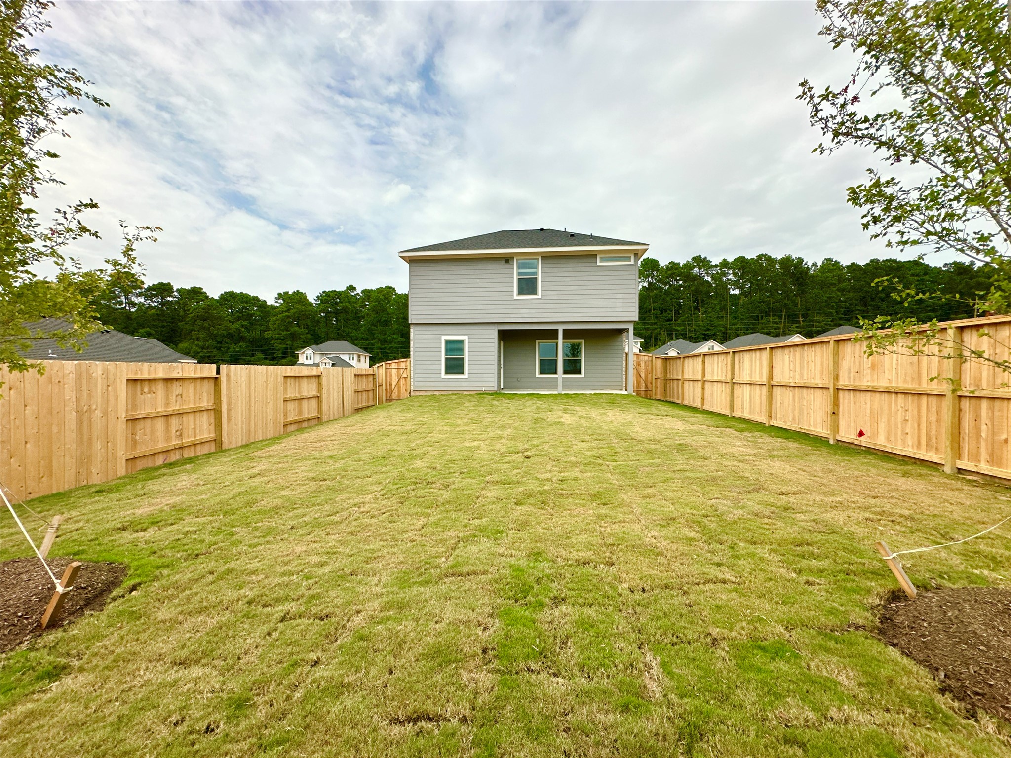 12198 Ridge Top Drive Conroe, TX 77304 - Photo 18 of 27 a house view with swimming pool in front of it