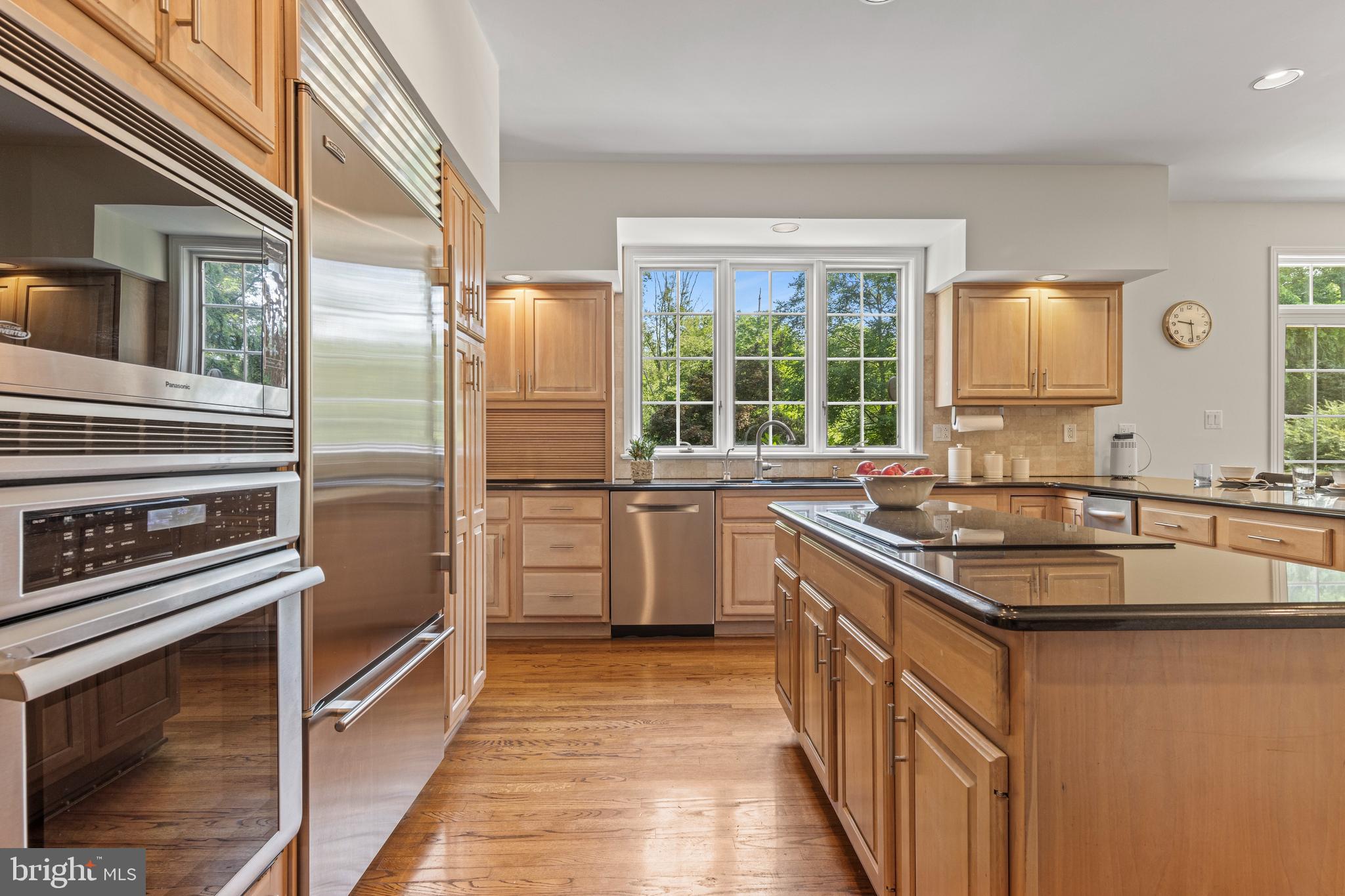 1285 Farm Road Berwyn, PA 19312 - Photo 21 of 75 a kitchen with stainless steel appliances granite countertop a sink stove and refrigerator