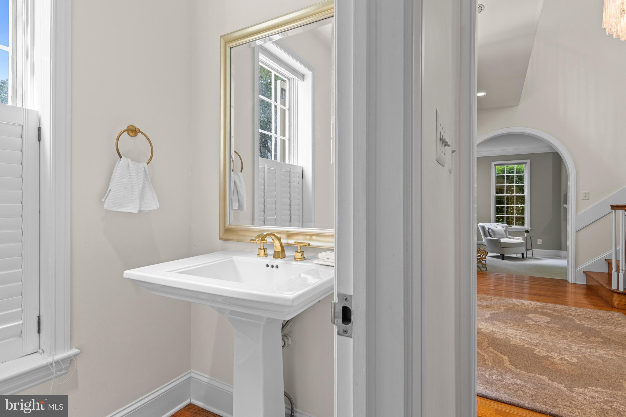 1285 Farm Road Berwyn, PA 19312 - Photo 33 of 75 a bathroom with a sink a mirror and a toilet