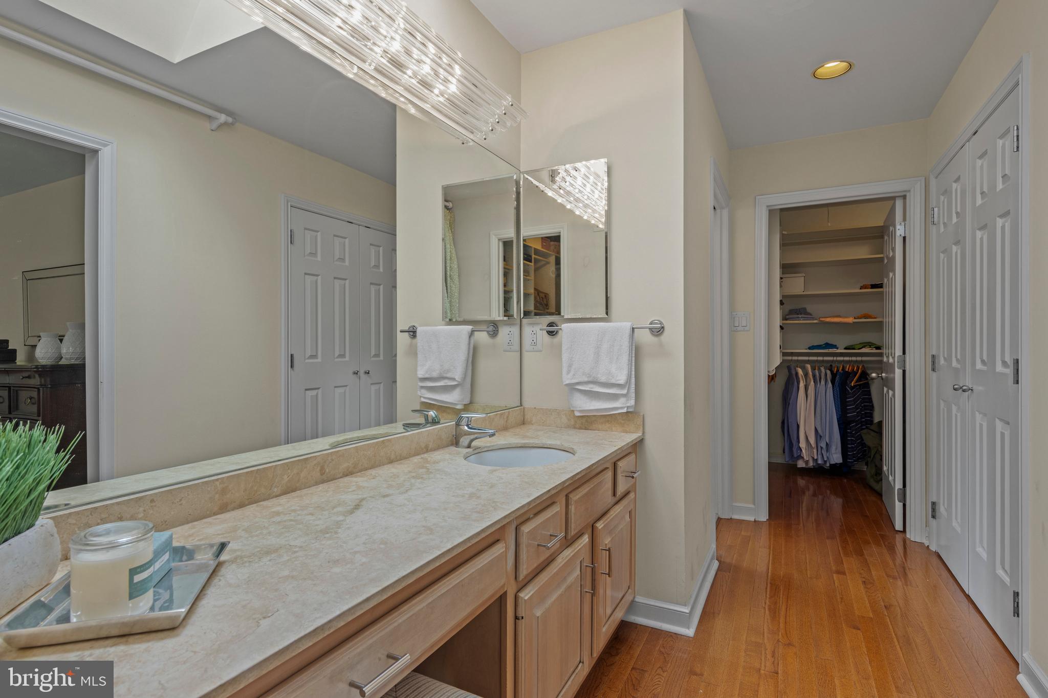 1285 Farm Road Berwyn, PA 19312 - Photo 38 of 75 a bathroom with a granite countertop sink a mirror and shower