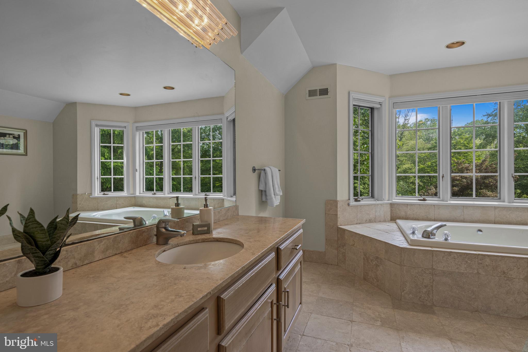 1285 Farm Road Berwyn, PA 19312 - Photo 39 of 75 a bathroom with a granite countertop tub and a sink