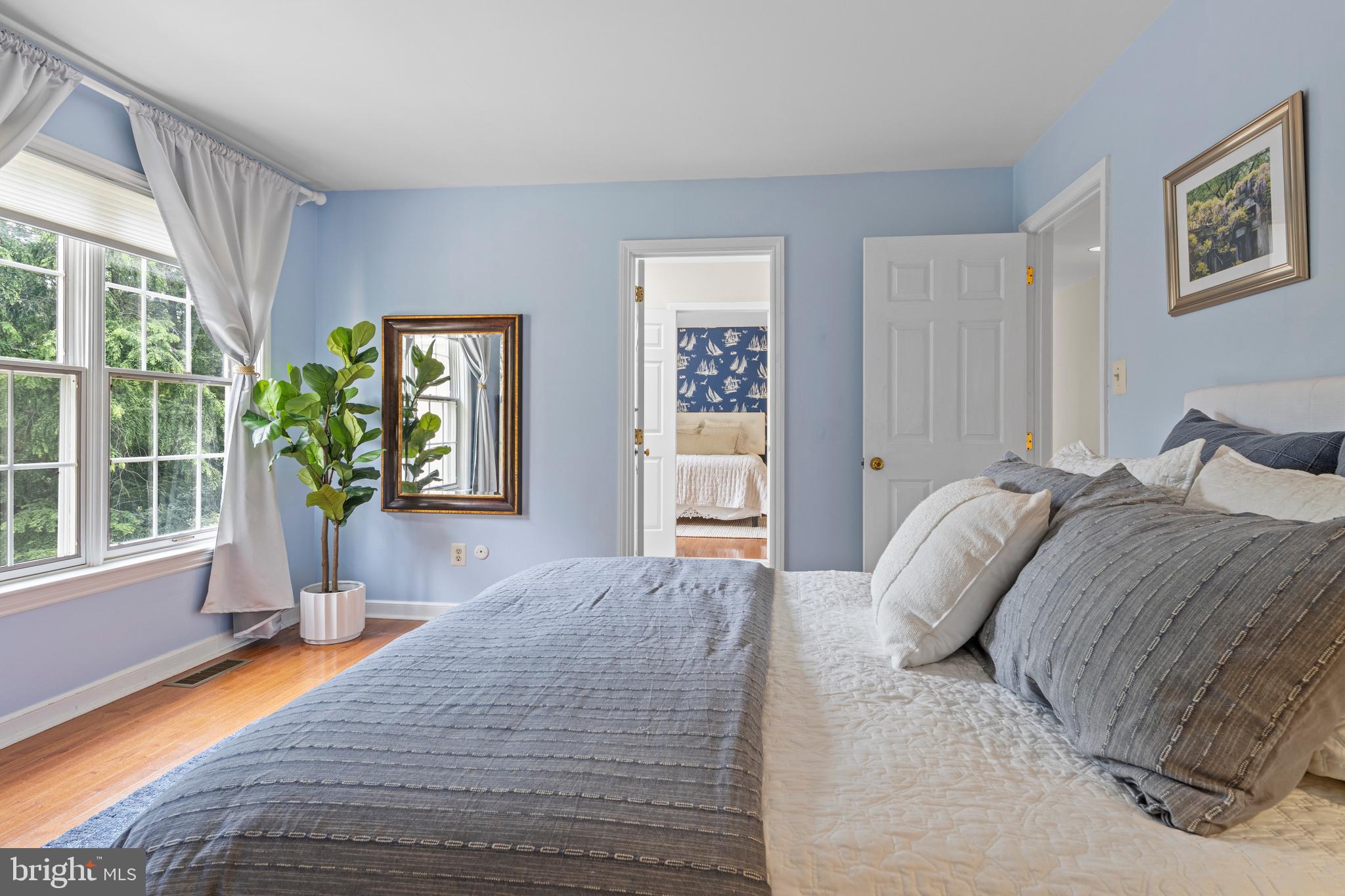 1285 Farm Road Berwyn, PA 19312 - Photo 42 of 75 a bedroom with a bed and a large window