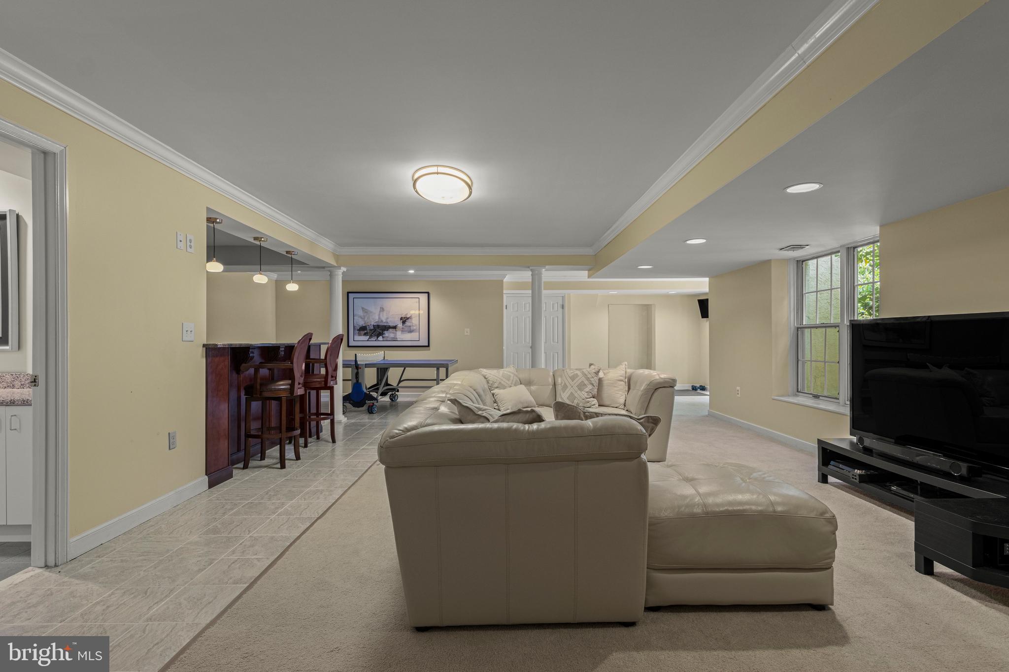 1285 Farm Road Berwyn, PA 19312 - Photo 51 of 75 a living room with furniture and a flat screen tv