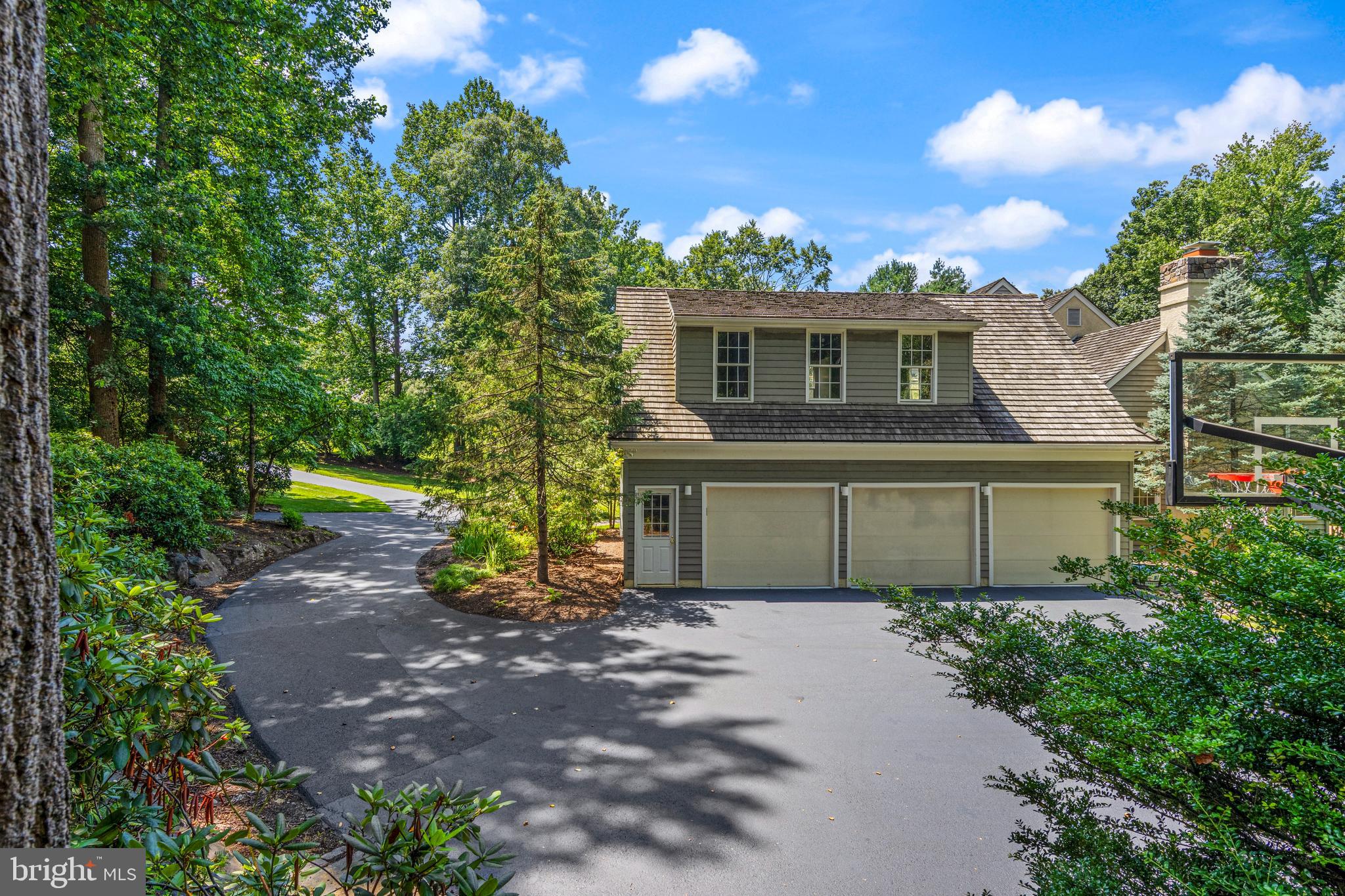 1285 Farm Road Berwyn, PA 19312 - Photo 58 of 75 a front view of a house with a yard and trees
