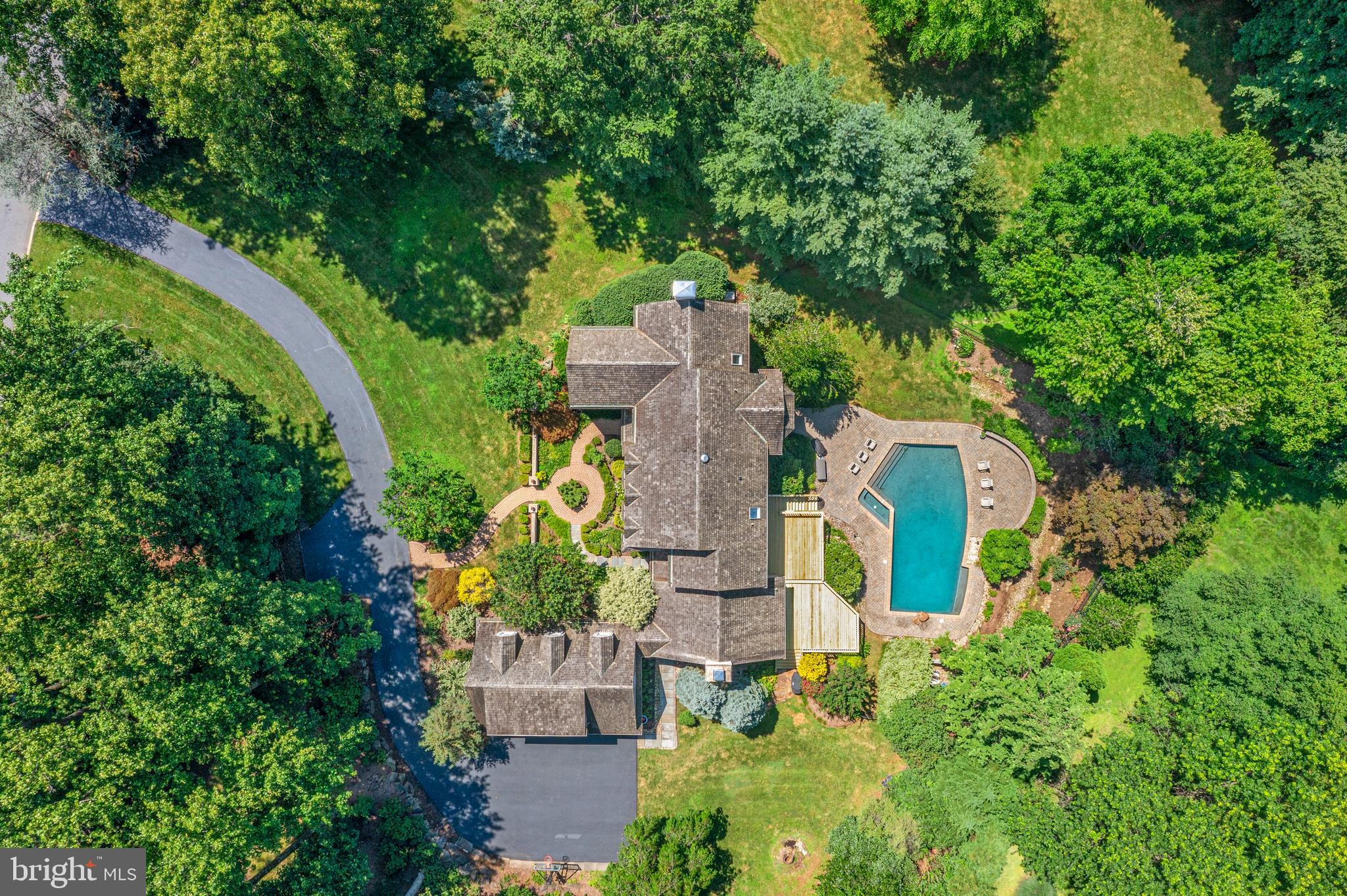 1285 Farm Road Berwyn, PA 19312 - Photo 69 of 75 an aerial view of a house with a yard and garden