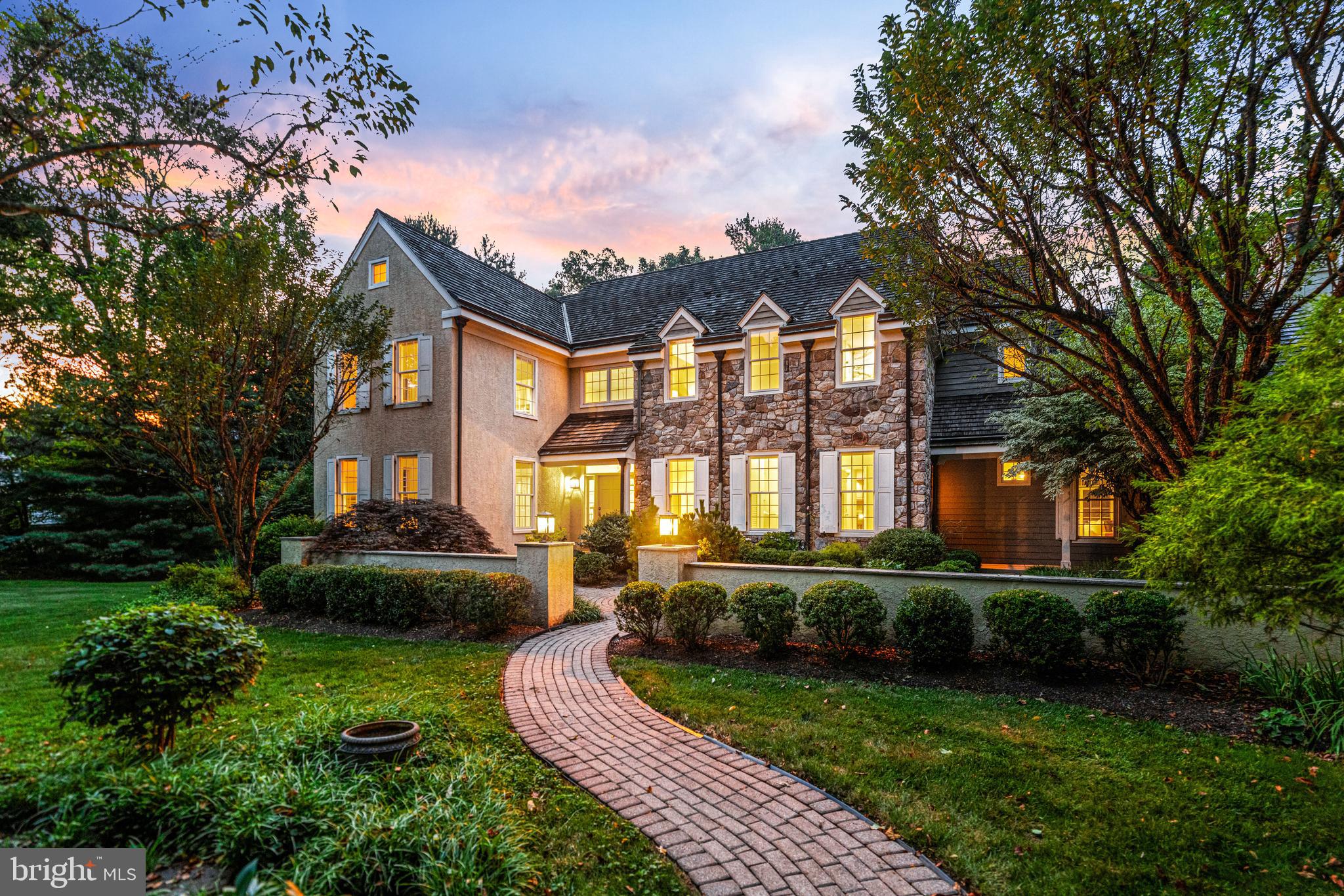 1285 Farm Road Berwyn, PA 19312 - Photo 7 of 75 a front view of a house with a yard table and chairs