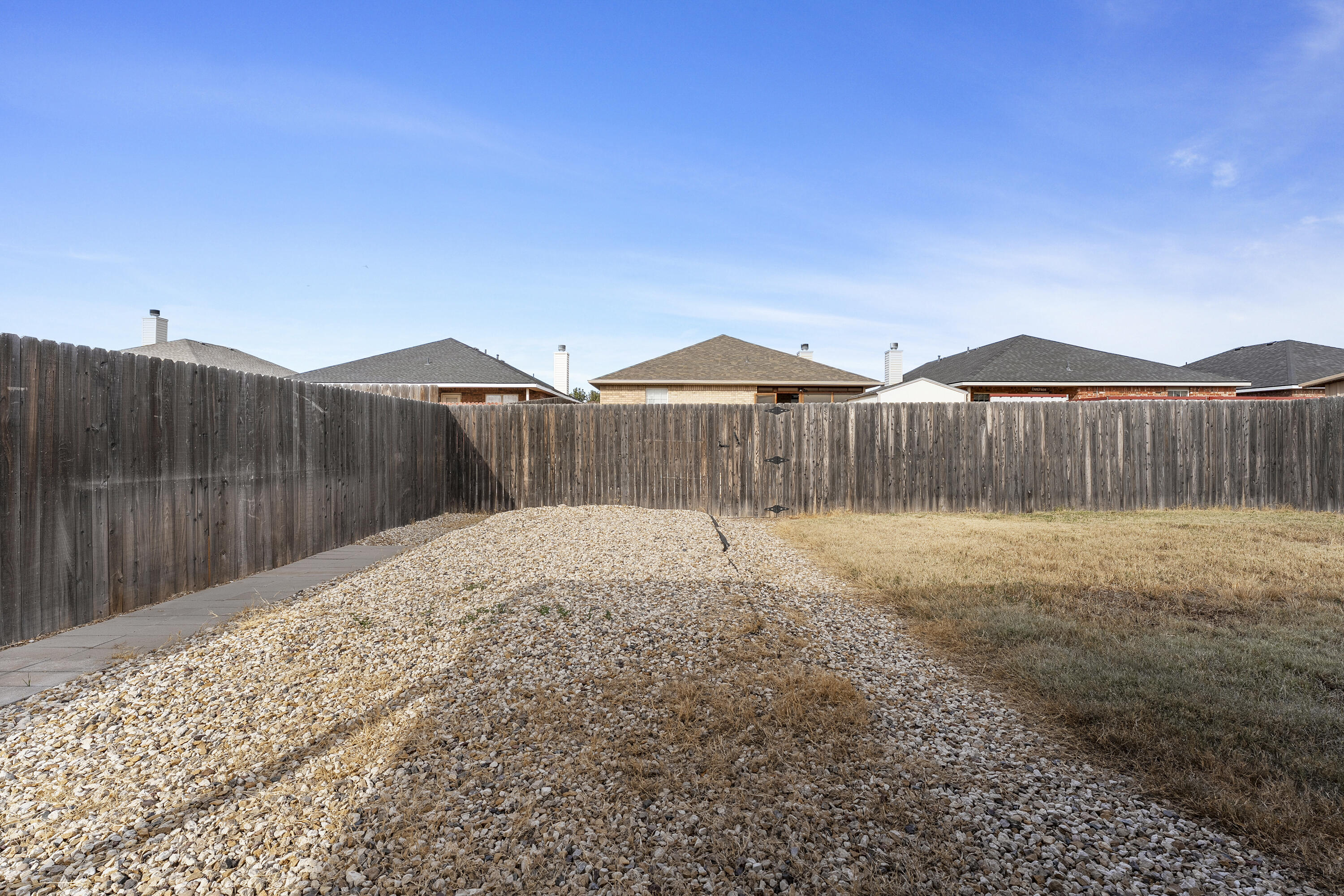 6522 93rd Street Lubbock, TX 79424 - Photo 20 of 22 a backyard of a house