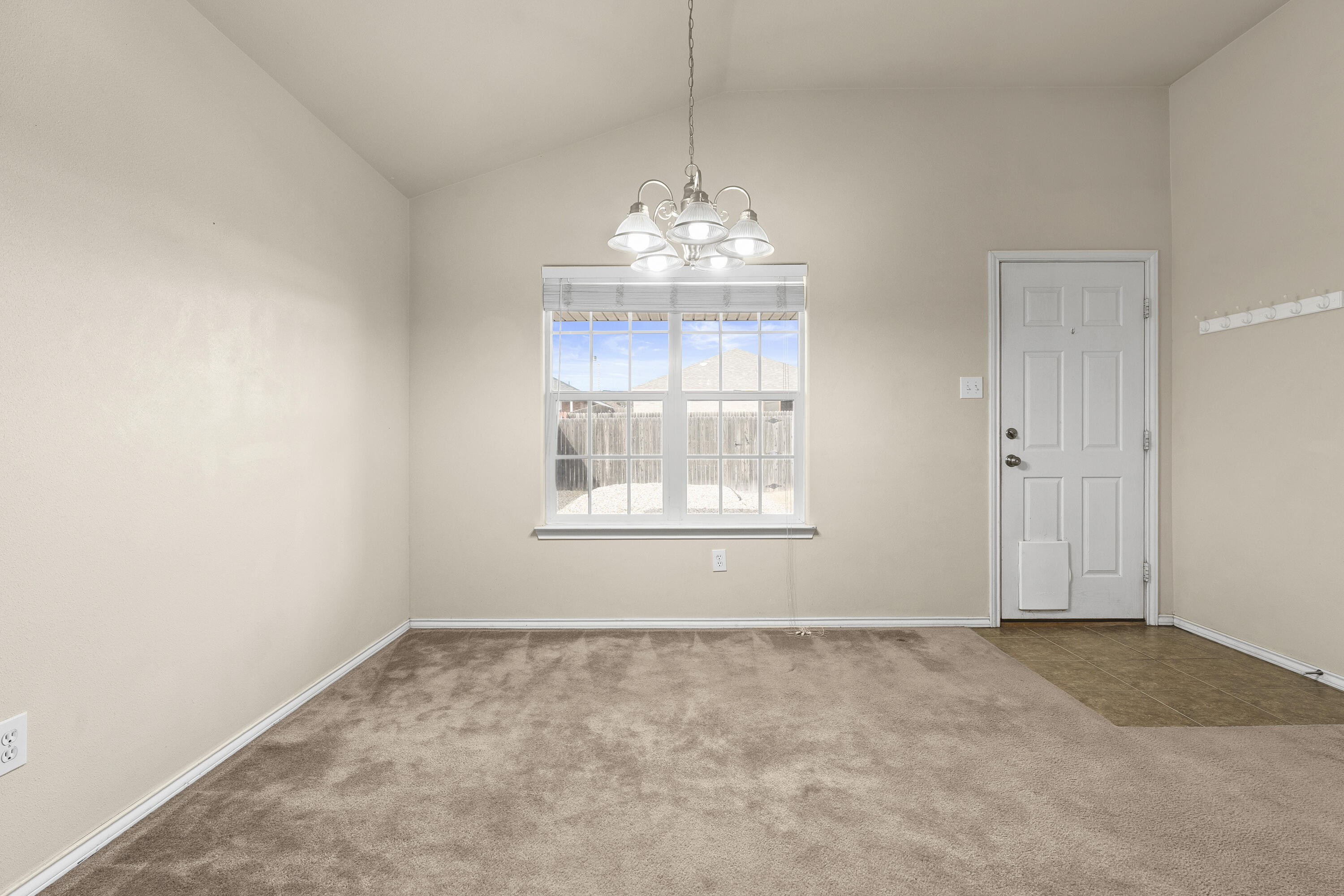 6522 93rd Street Lubbock, TX 79424 - Photo 9 of 22 a view of an empty room with a window