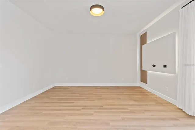 a view of a livingroom with wooden floor