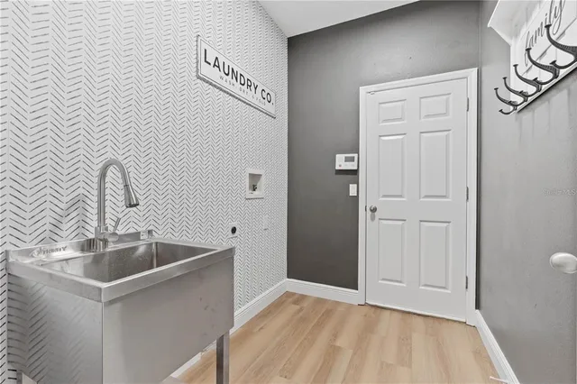 a kitchen with a sink and cabinets