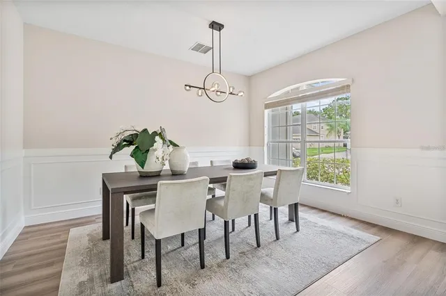 a view of a dining room with furniture window and outside view