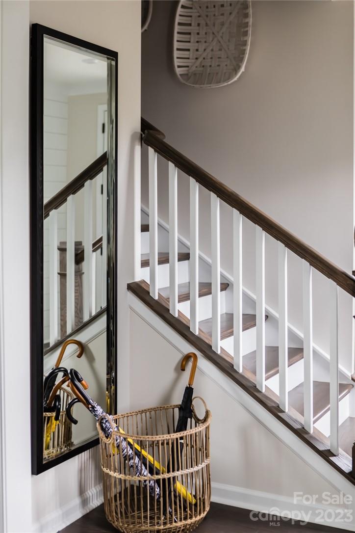 216 Brooks Springs Drive Fort Mill, SC 29708 - Photo 11 of 24 a view of staircase with lots of frames on wall and a window