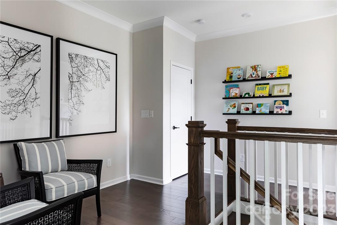 216 Brooks Springs Drive Fort Mill, SC 29708 - Photo 13 of 24 a view of a hallway with wooden floor and stairs