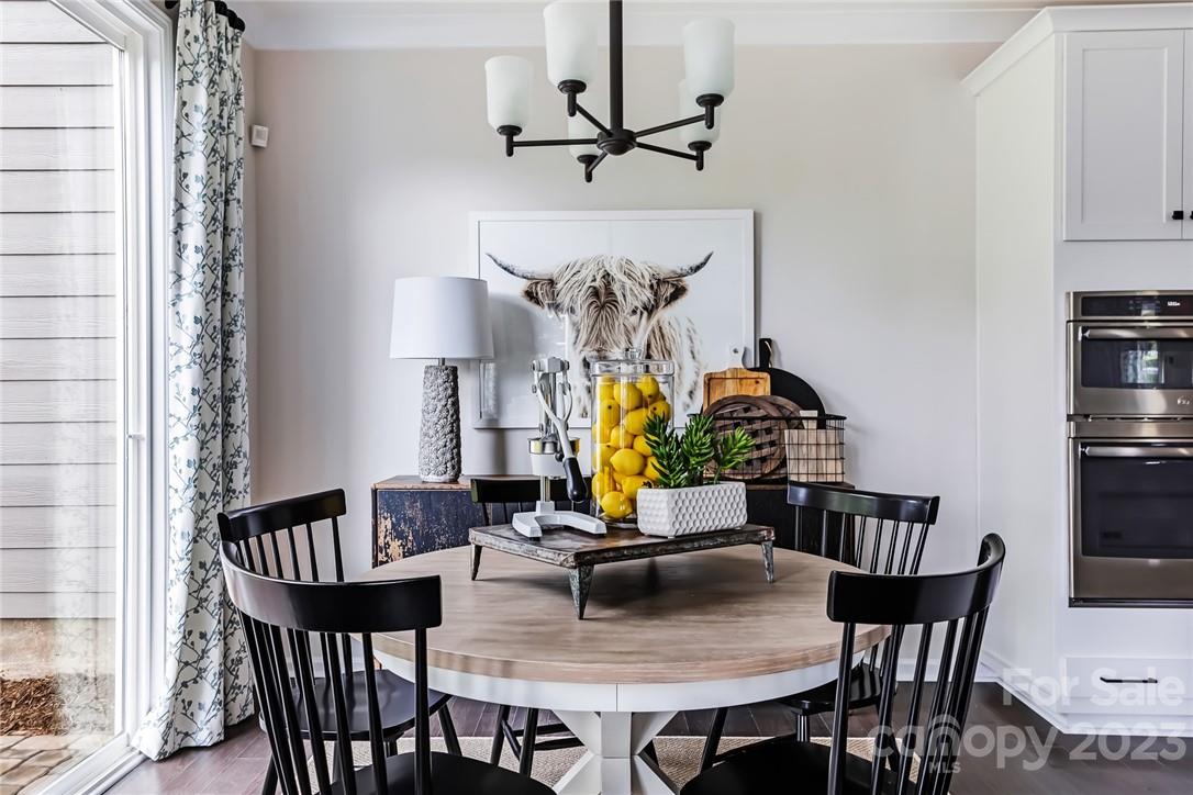 216 Brooks Springs Drive Fort Mill, SC 29708 - Photo 2 of 24 a view of a dining room with furniture