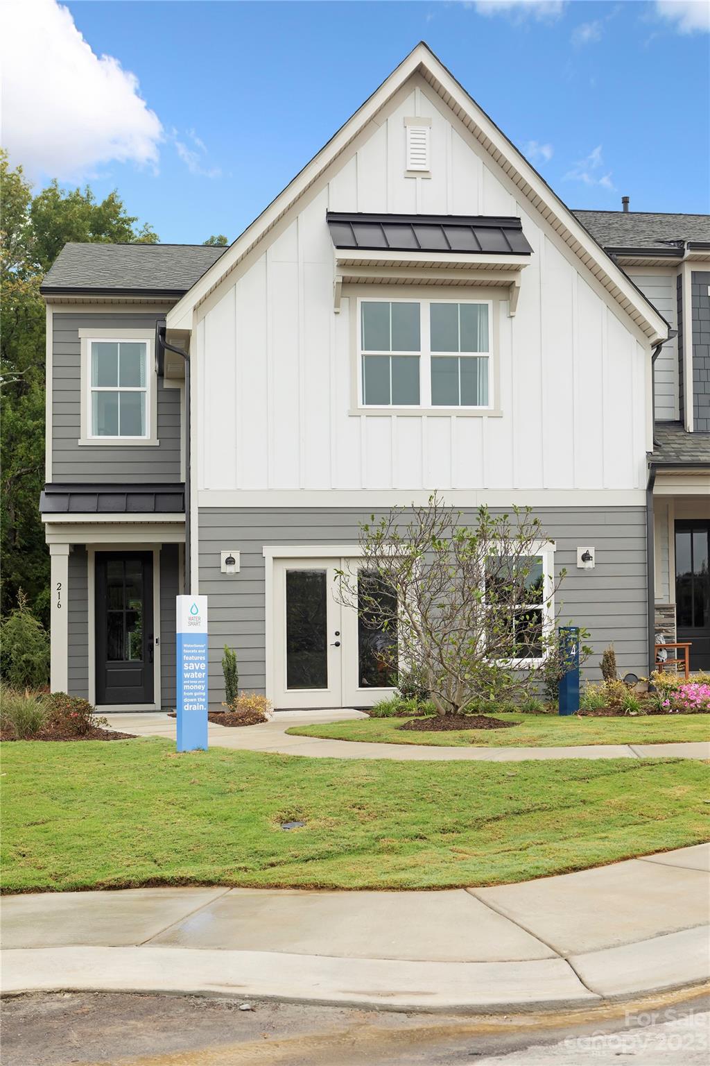 216 Brooks Springs Drive Fort Mill, SC 29708 - Photo 3 of 24 a view of a house with a yard and large windows
