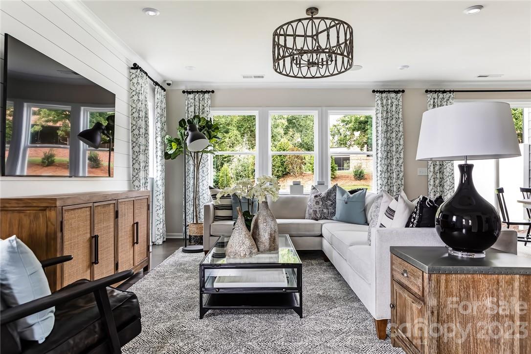 216 Brooks Springs Drive Fort Mill, SC 29708 - Photo 6 of 24 a living room with furniture chandelier and a window