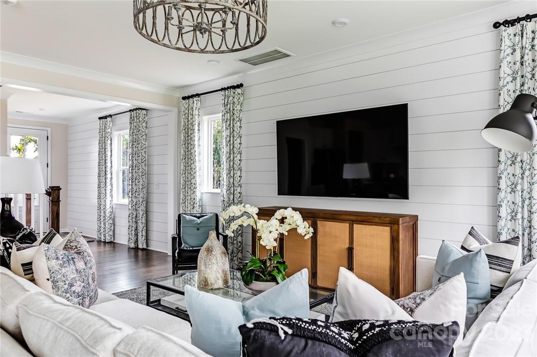 216 Brooks Springs Drive Fort Mill, SC 29708 - Photo 8 of 24 a living room with furniture a flat screen tv and a fireplace