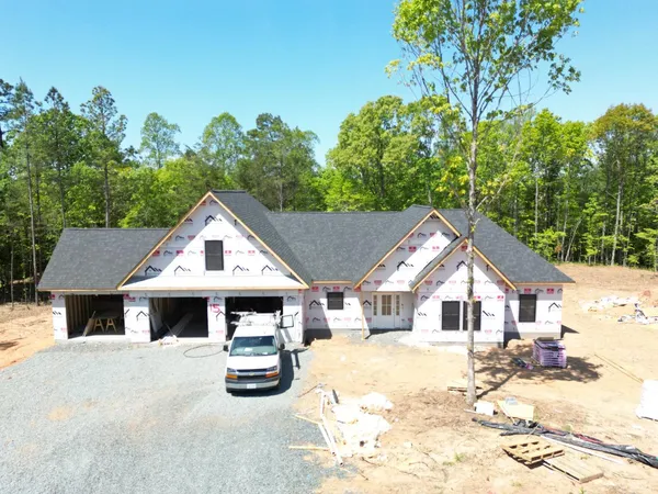 a view of house and yard with green space
