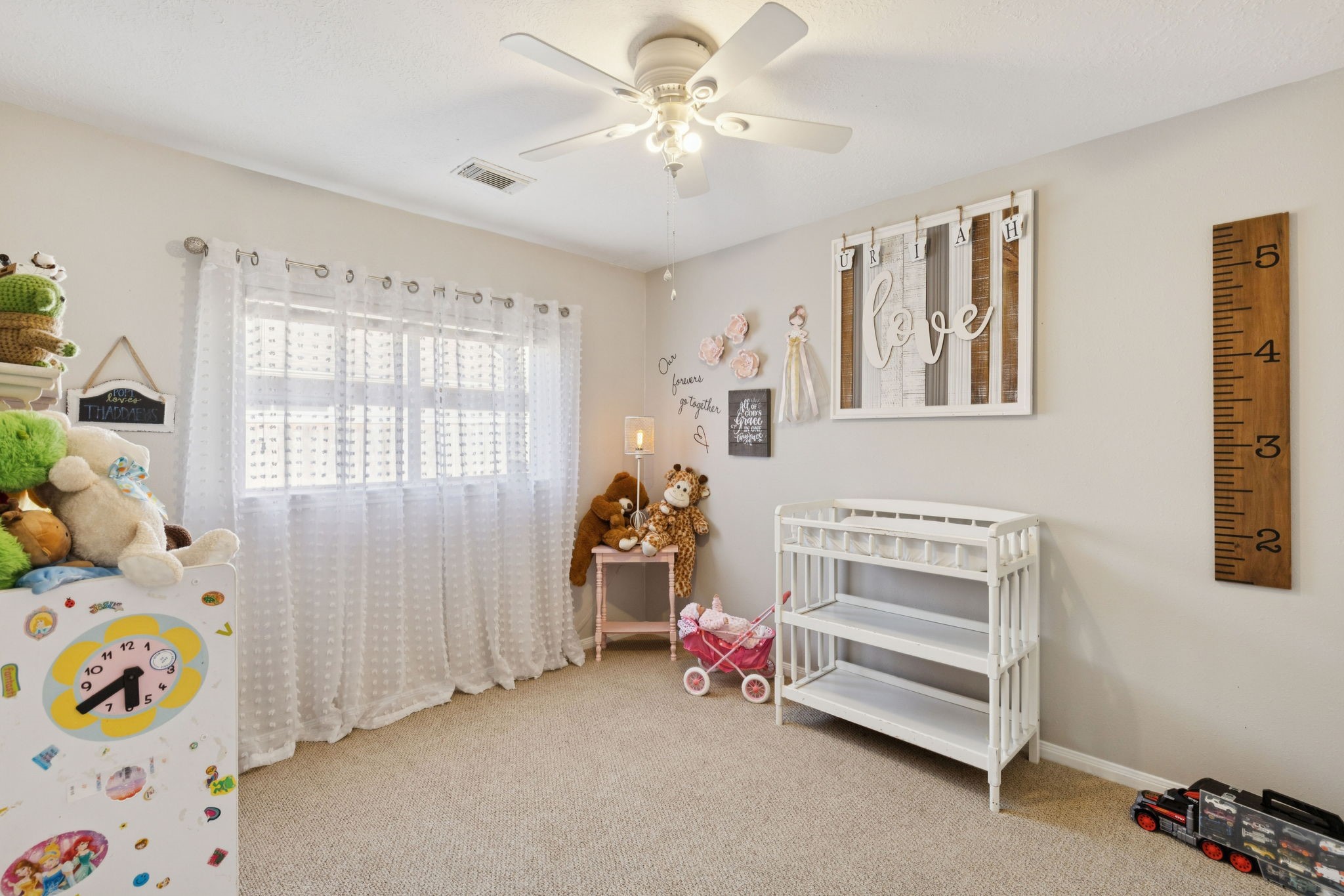16322 Mango Ridge Court Humble, TX 77396 - Photo 15 of 20 a view of a bedroom with baby crib and a window