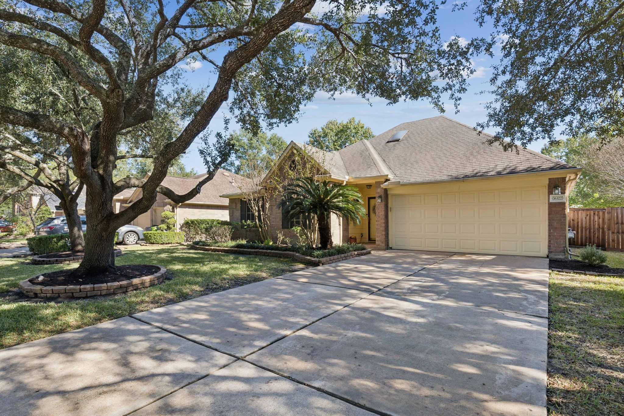 16322 Mango Ridge Court Humble, TX 77396 - Photo 17 of 20 a view of a house with a yard and tree s
