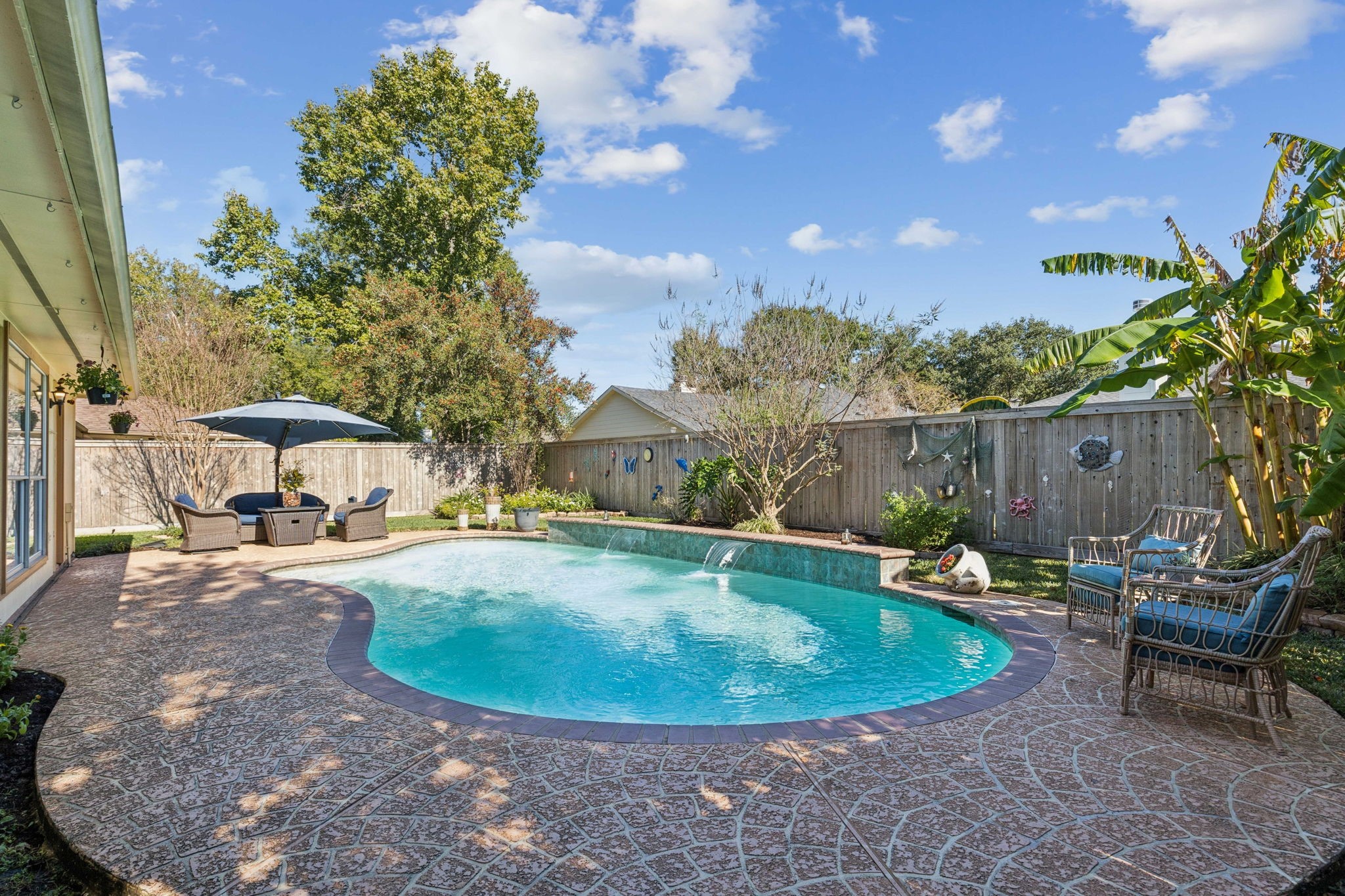 16322 Mango Ridge Court Humble, TX 77396 - Photo 2 of 20 a view of a swimming pool with lounge chair