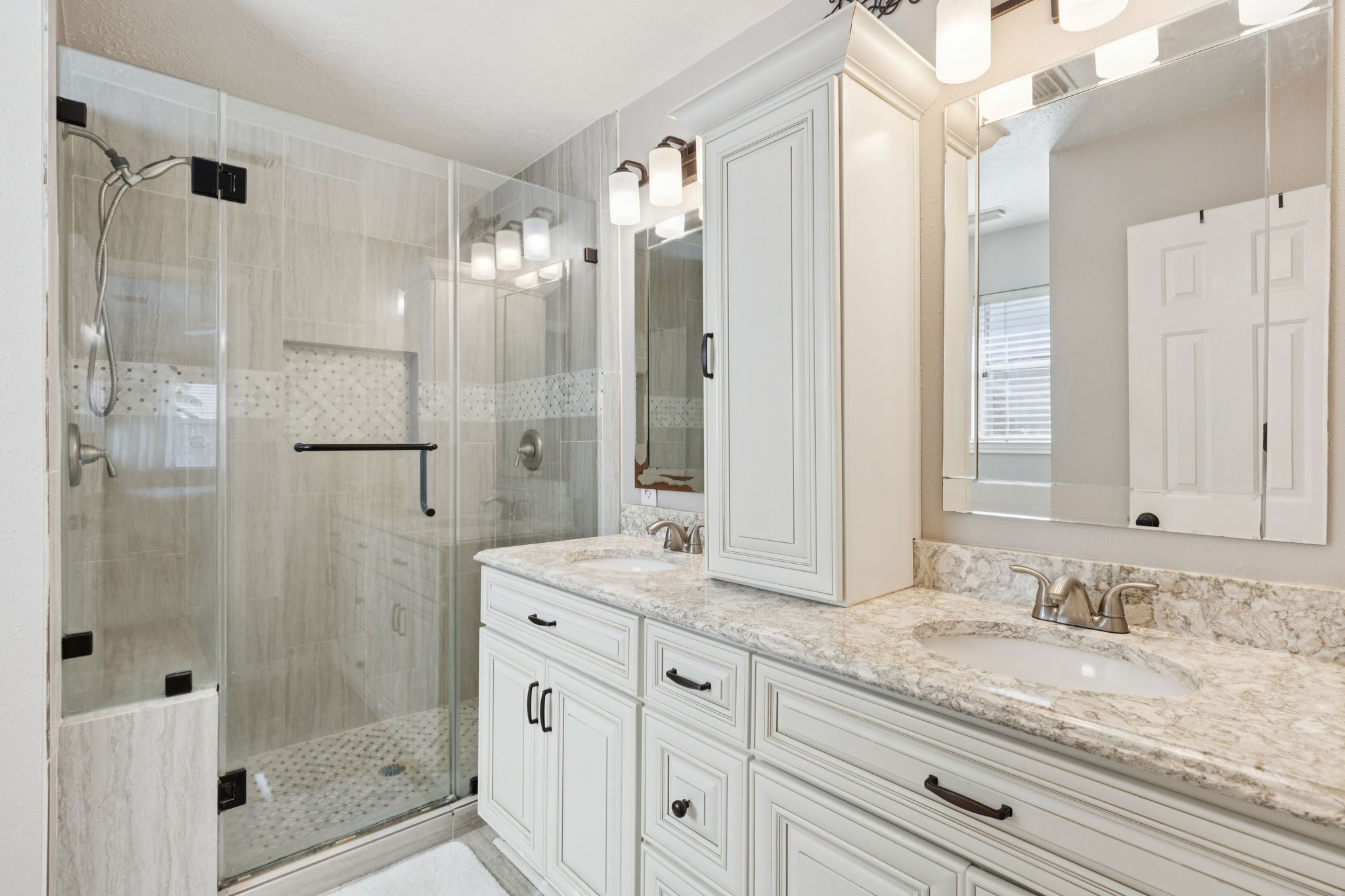 16322 Mango Ridge Court Humble, TX 77396 - Photo 5 of 20 a bathroom with a granite countertop sink mirror and shower