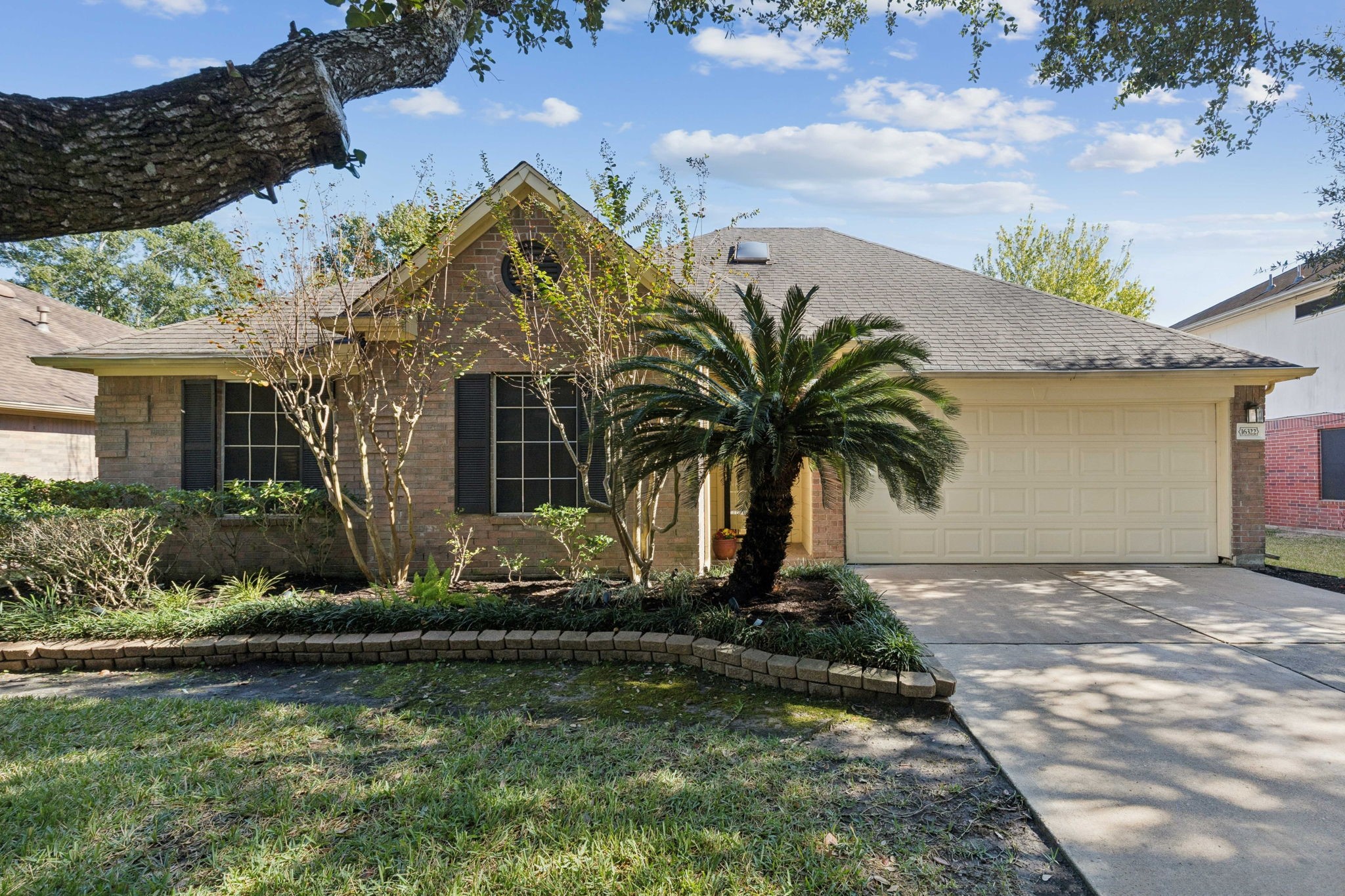 16322 Mango Ridge Court Humble, TX 77396 - Photo 6 of 20 a front view of a house with garden