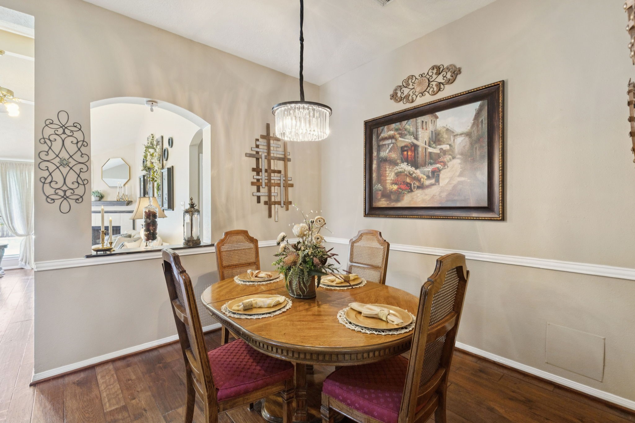 16322 Mango Ridge Court Humble, TX 77396 - Photo 7 of 20 a dining room with furniture a chandelier and wooden floor