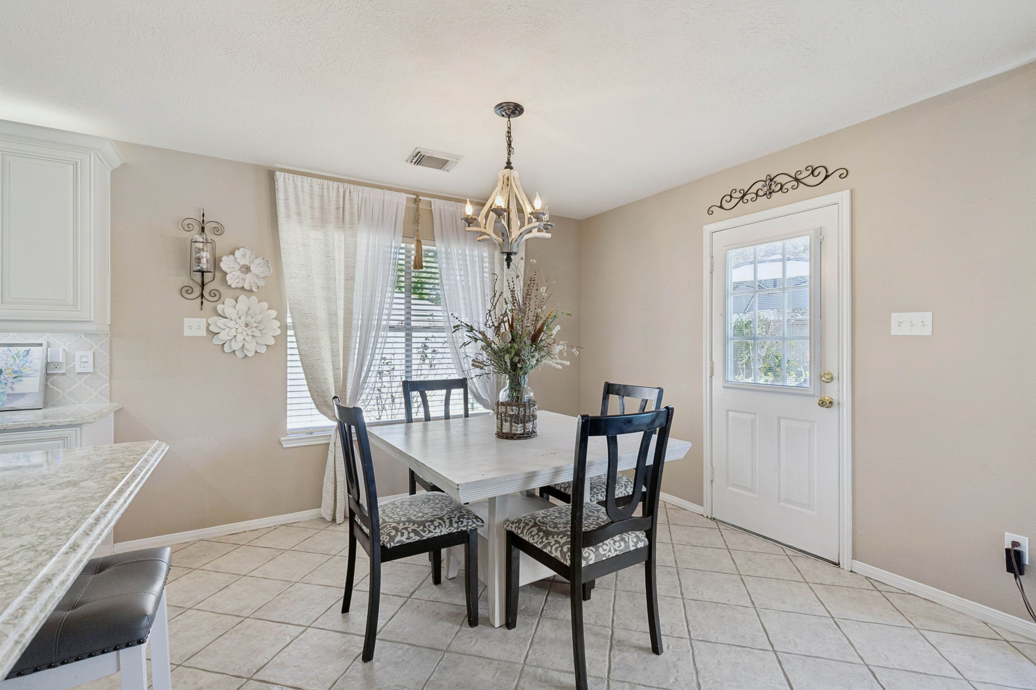 16322 Mango Ridge Court Humble, TX 77396 - Photo 10 of 20 a view of a dining room with furniture and window