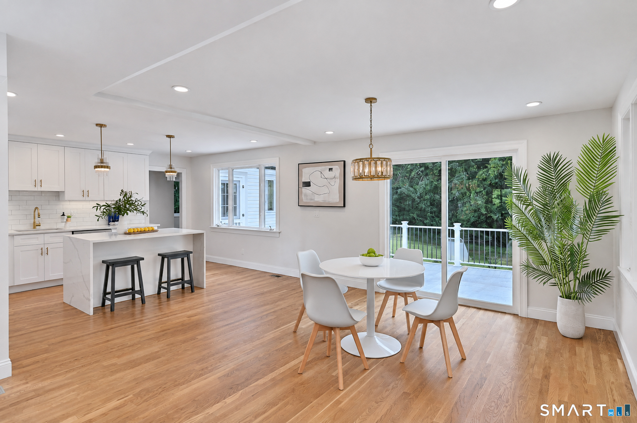 34 Rimmon Road Woodbridge, CT 06525 - Photo 9 of 40 Open dining area with hardwood floors and access to the outdoor living space.