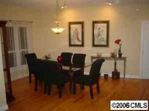 25024 Riley Lane Tega Cay, SC 29708 - Photo 3 of 8 a view of a dining room with furniture and wooden floor