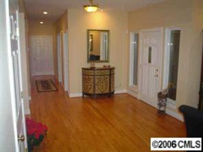 25024 Riley Lane Tega Cay, SC 29708 - Photo 8 of 8 a view of a hallway with a kitchen