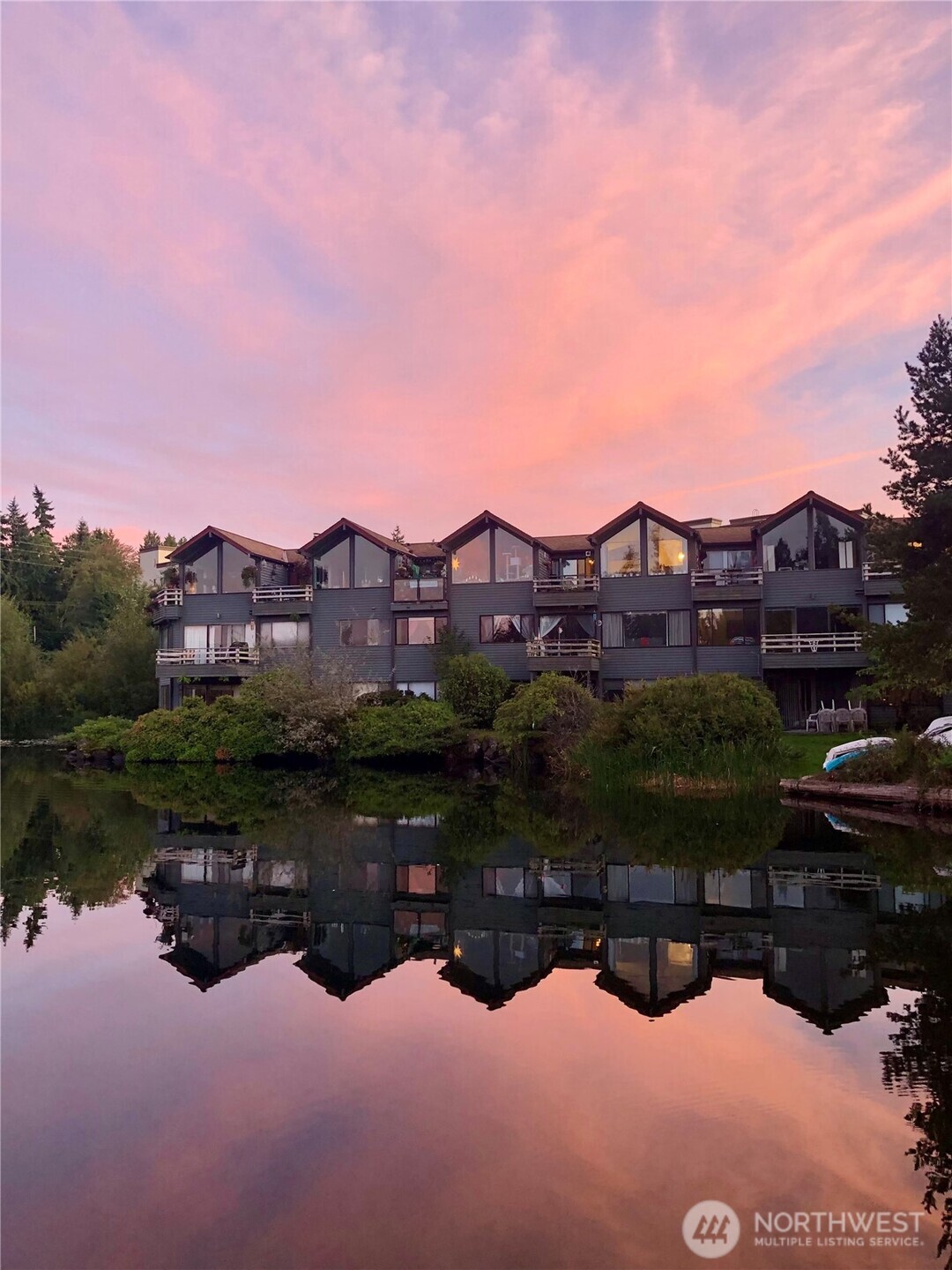 a view of a lake with a houses in the back